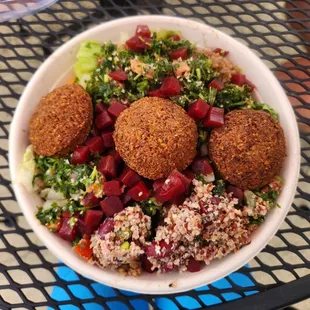 Falafel bowl. Checking out new options, quinoa salad and biryani rice.