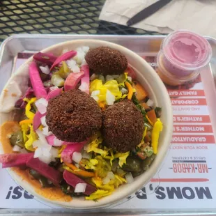 Falafel bowl. They now offer two new pickled salads