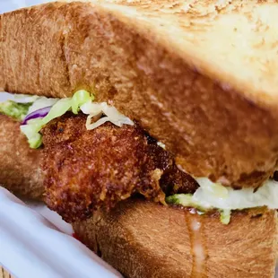 a fried chicken sandwich with coleslaw