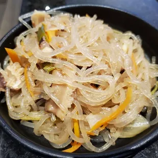 Japchae. You can just tell by the color how relatively bland it is.
