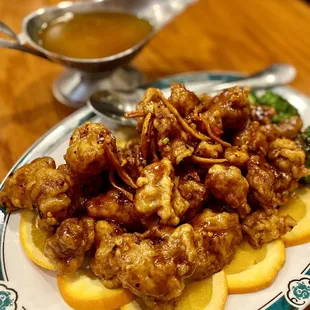 Orange chicken (gravy at back is for lemon chicken)