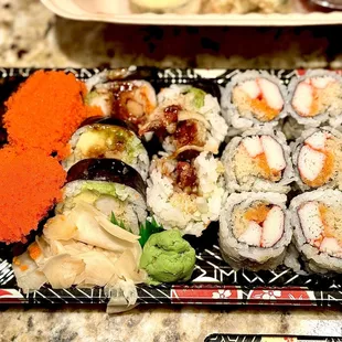 Flying fish roe sushi, shrimp tempura roll, kani crunch roll