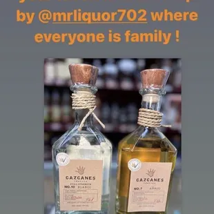 two bottles of liquor on a table