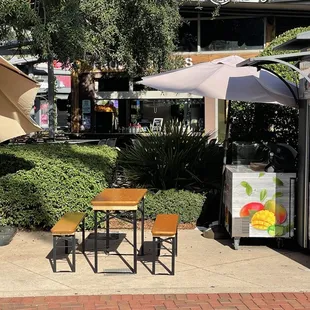 tables and umbrellas outside a restaurant
