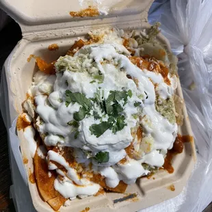 a styrofoam enchilado in a styrofoam