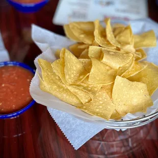 a bowl of tortillas and salsa