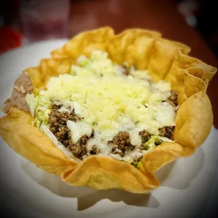 a closeup of a taco in a tortilla basket