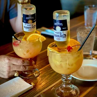 Corona, orange juice, lemonade, patron, and grenadine. Yum!