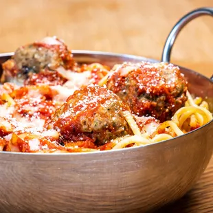 a bowl of spaghetti and meatballs