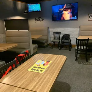 an empty restaurant with tables and chairs