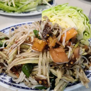 Lao style papaya with kaopoon noodles. The medium spicy is spppiiicccyyy but super darn yummy.