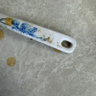 Not sure why anyone would bring out a dirty serving spoon, but this is disgusting.