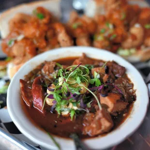  bowl of soup and a sandwich