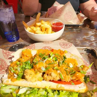 Shrimp Po Boy, with tons of shrimp and an Etouffee sauce instead of Remoulade.