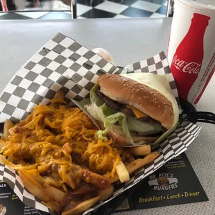 cheese burger chili fries and a soda.