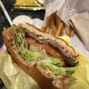 Cheeseburger with everything (grilled onions).