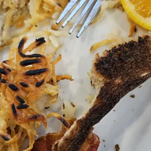 Burnt toast and hash browns.