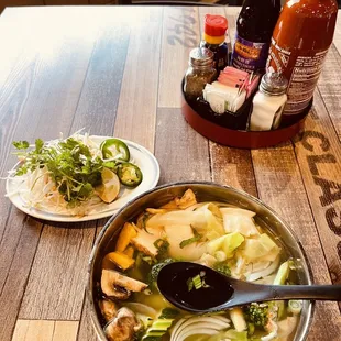 Veggie Bowl of Pho with toppings and seasonings