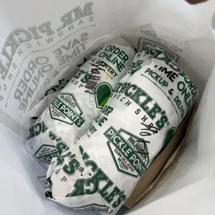 two wrapped sandwiches