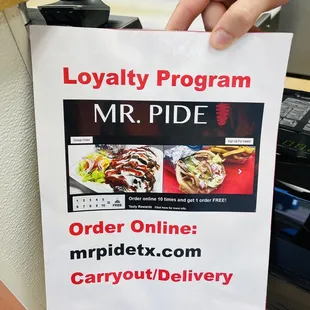 a person holding up a sign