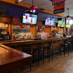 a bar with a large screen tv