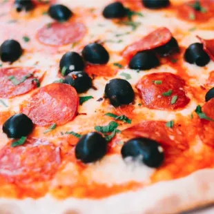 a pepperoni and olive pizza