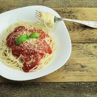 a plate of spaghetti with tomato sauce