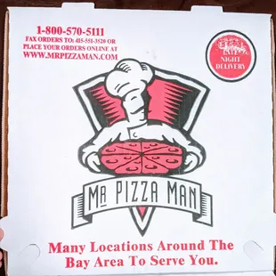 a man holding a box of pizza