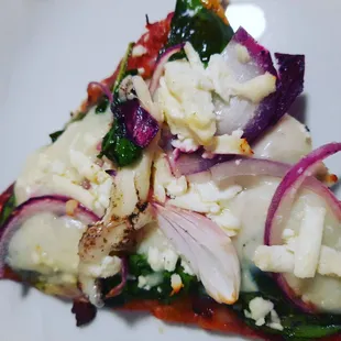 pizza  slice spinach feta onion pesto