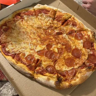a pepperoni pizza in a box