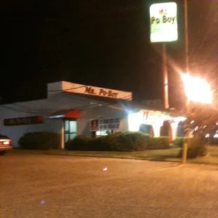 the front of a restaurant at night