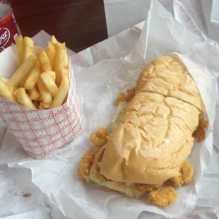 8" shrimp poboy with fries.  I think just the sandwich was $8.95.
