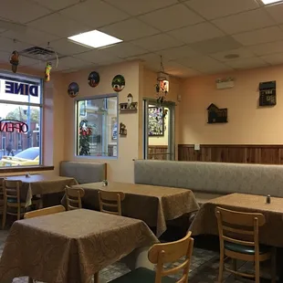 a dining area with tables and chairs