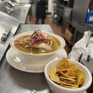 a bowl of soup and a bowl of tortillas