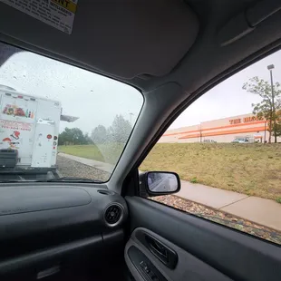 a view of a truck from inside a car