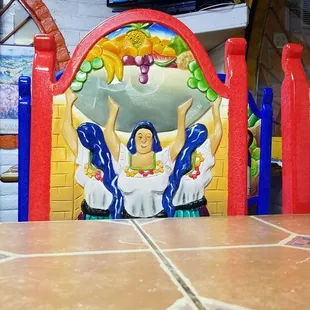 a statue of a woman in a mexican dress