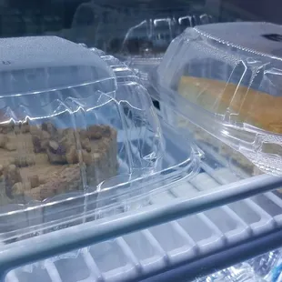 two containers of food in a refrigerator