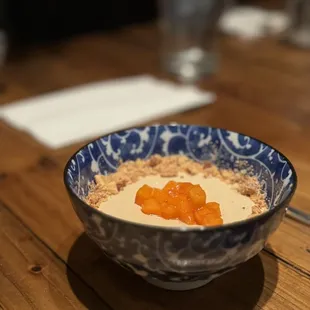 a bowl of oatmeal on a wooden table