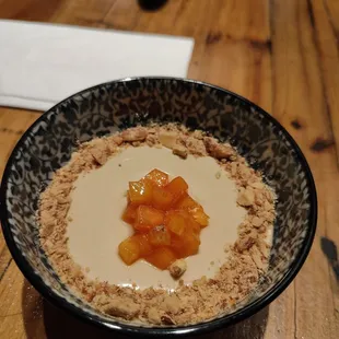 Earl grey Pannacotta topped with persimmon