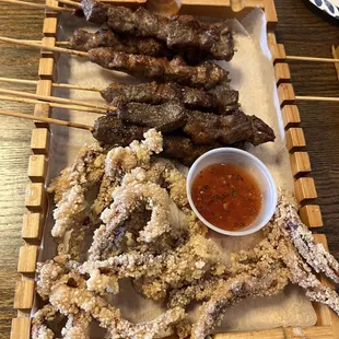 skewered steaks and dipping sauce