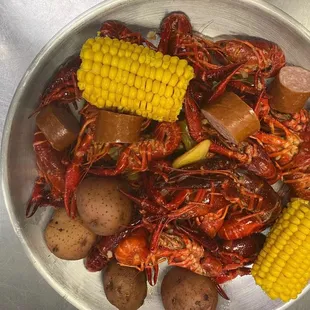 a bowl of craw and potatoes