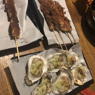 Squid, chicken, beef on the sticks and grilled oysters