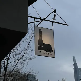 a picture of a building with a factory in the background