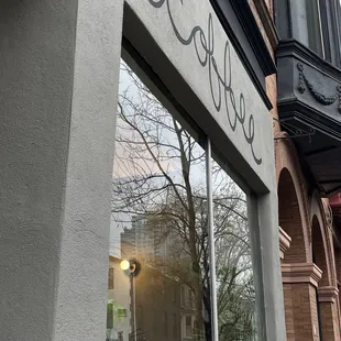 the reflection of a building in the window