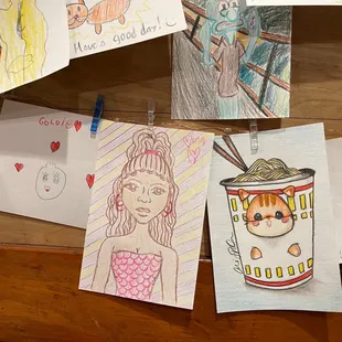 children's drawings on a table