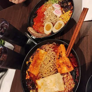 Spicy level 1 ramen with tofu (bottom) and pork (top)
