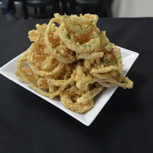 a pile of fried onion rings