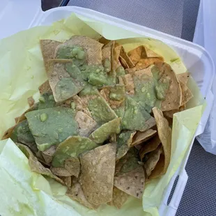 Chips with a sad amount of watery Guacamole