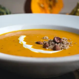 a bowl of soup with a spoon in it