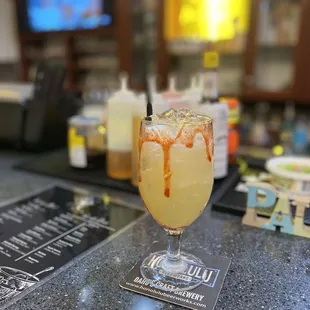 a glass with a liquid drizzle on it